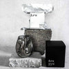 Hand blown candle of fragrance scent spot on - sitting on bricks on concrete background.