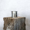 Large sized silver travel tin candle of fragrance scent  sweet baby jesus - wide shot.