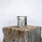 Large sized silver travel tin candle of the fragrance scent toscana - wide shot.