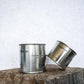 Group image of flure's travel tin collection in fragrance scent spot on in medium and large size close up.