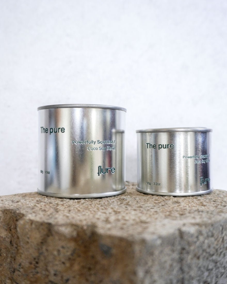 Group image of flure's travel tin collection in fragrance scent the pure in medium and large size - close up.