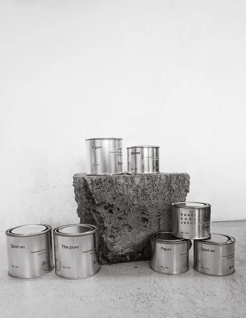 Group image of flure's travel tin collection in different scents and sizes.