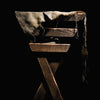 Luxury candle scent image for the fragrance sweet baby Jesus. A top selling scent of flure's. Picture of baby manger in dark room with spotlight on manger.