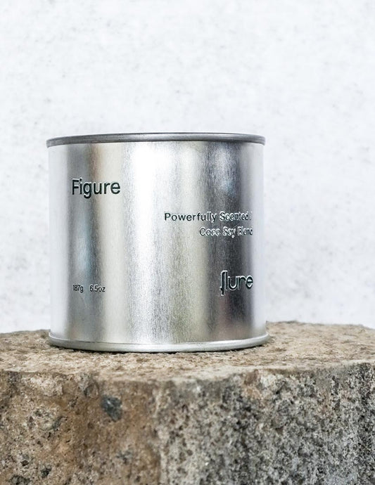 Large sized silver travel tin candle of scent figure front shot
