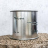 Large sized silver travel tin candle of the fragrance scent toscana - close up.