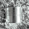 Medium sized silver travel tin candle of fragrance scent sweet baby jesus - close up.