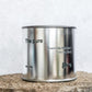 Large sized silver travel tin candle of fragrance scent the pure - close up shot.