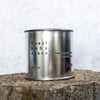 Large sized silver travel tin candle of fragrance scent  sweet baby jesus - close up image.