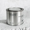 Medium sized silver travel tin candle of fragrance scent toscana - close up.